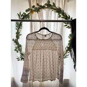 White, long sleeve top.